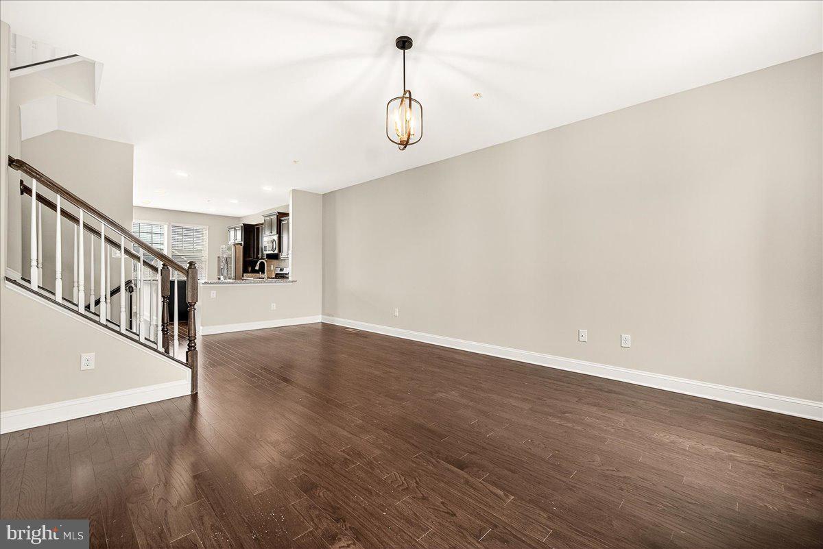 4654 Cambria Road Frederick, MD 21703 - Photo 15 of 55 a view of a room with wooden floor and white walls