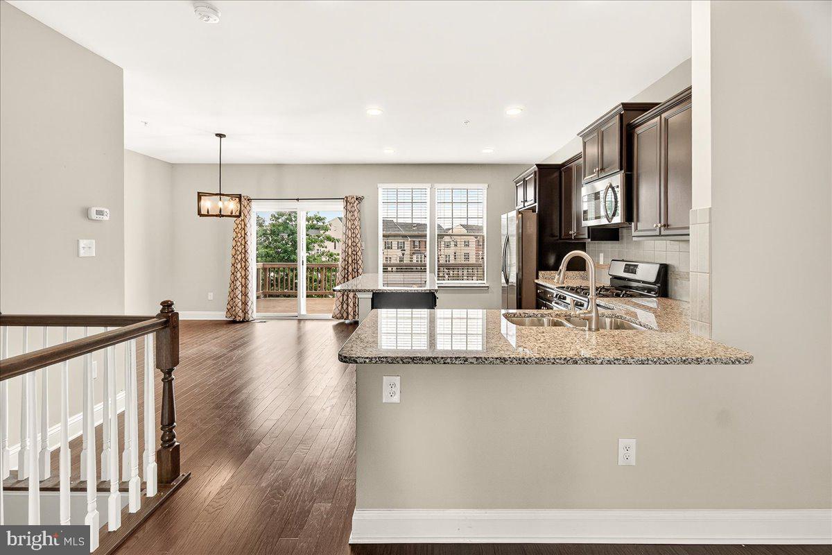 4654 Cambria Road Frederick, MD 21703 - Photo 17 of 55 a kitchen with counter top space and wooden floor