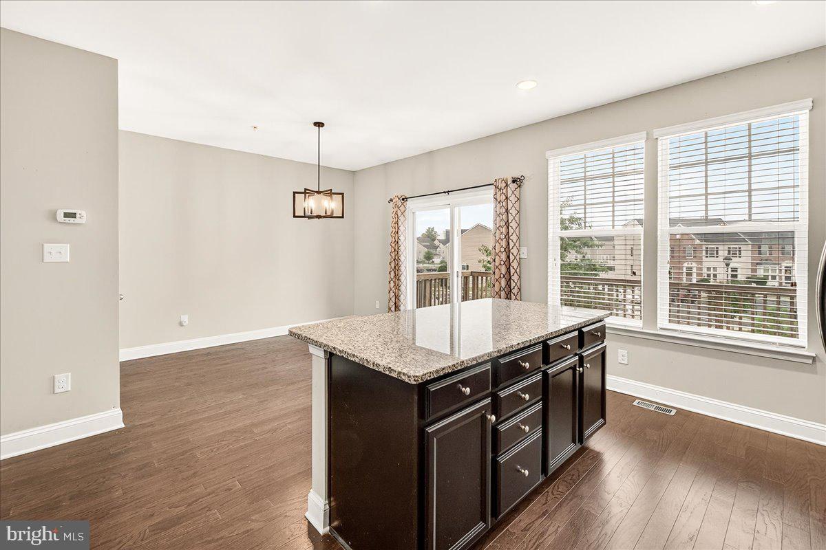 4654 Cambria Road Frederick, MD 21703 - Photo 20 of 55 a kitchen with a stove and a wooden floor