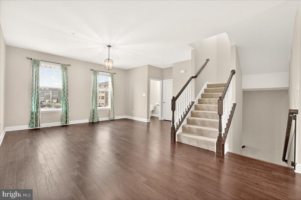 4654 Cambria Road Frederick, MD 21703 - Photo 26 of 55 wooden floor in an empty room with a window