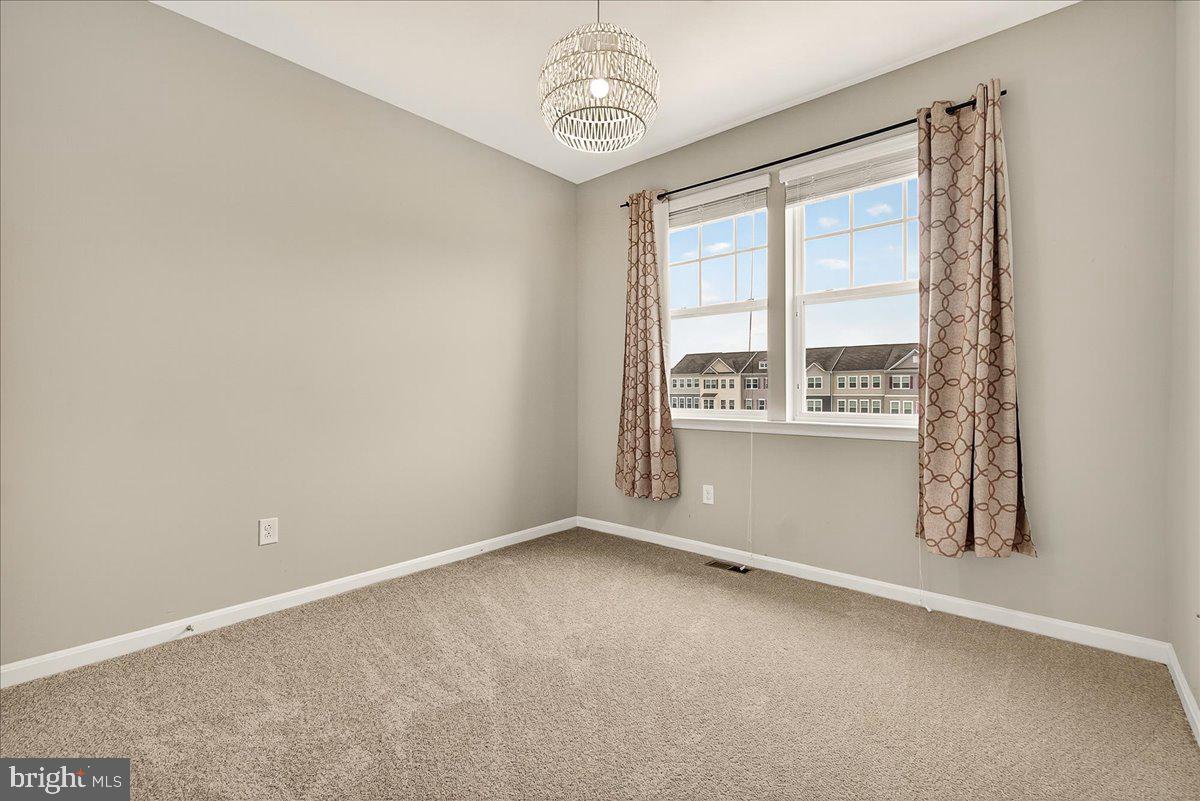 4654 Cambria Road Frederick, MD 21703 - Photo 28 of 55 wooden floor in an empty room with a window