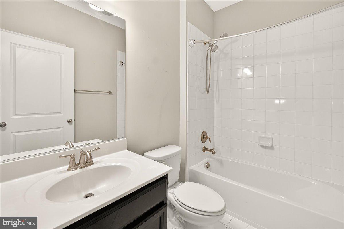 4654 Cambria Road Frederick, MD 21703 - Photo 30 of 55 a bathroom with a sink toilet vanity and shower