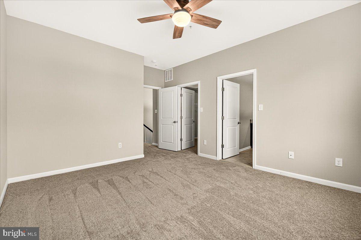 4654 Cambria Road Frederick, MD 21703 - Photo 32 of 55 an empty room with closet and a ceiling fan