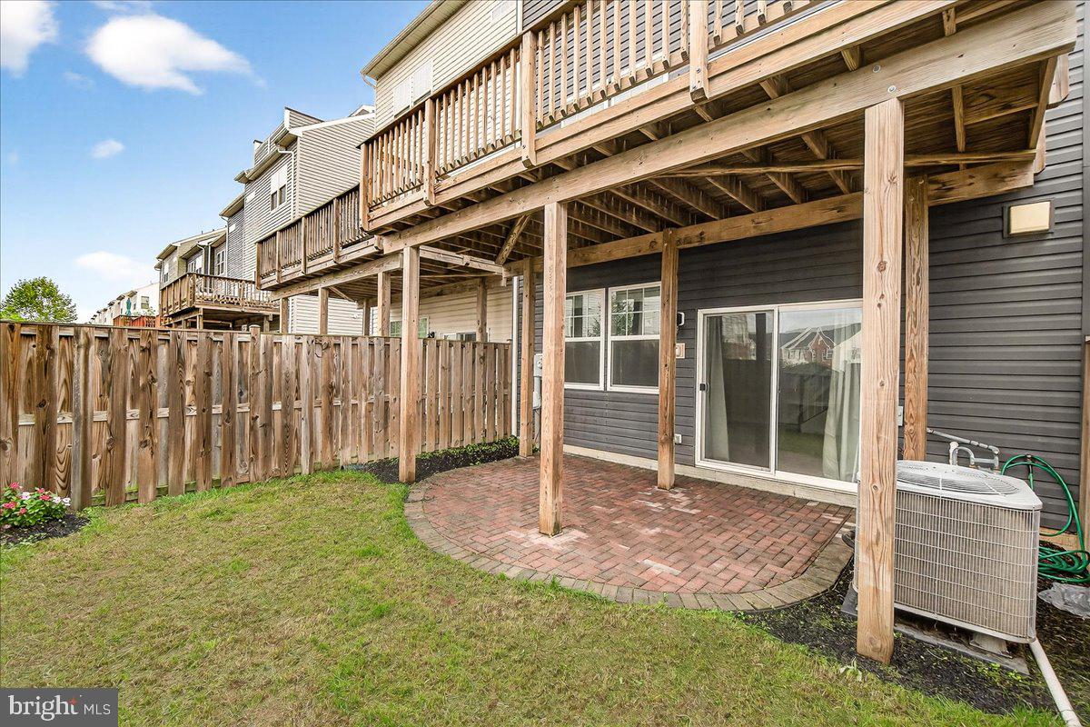 4654 Cambria Road Frederick, MD 21703 - Photo 38 of 55 a backyard of a house with table and chairs