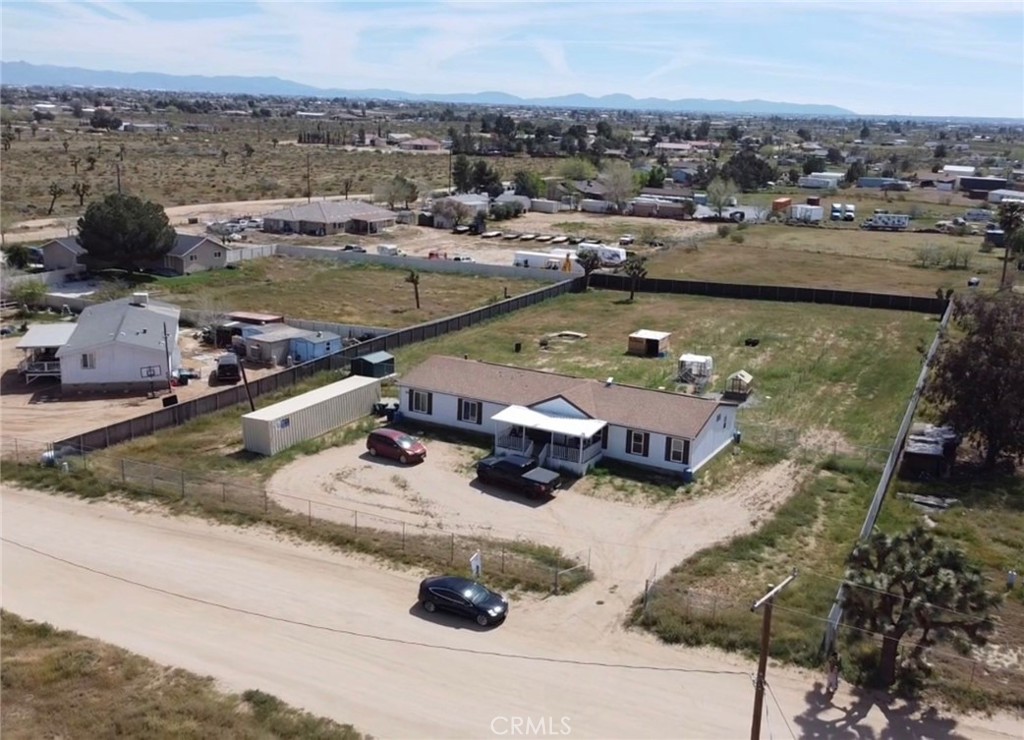 9235 Lindero Road Victorville, CA 92392 - Photo 2 of 11 a view of a lake with a house