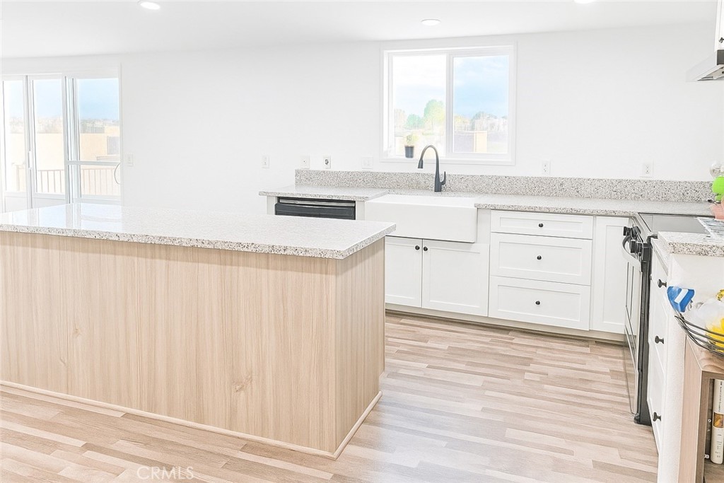 9235 Lindero Road Victorville, CA 92392 - Photo 5 of 11 a spacious bathroom with a sink a mirror and a window