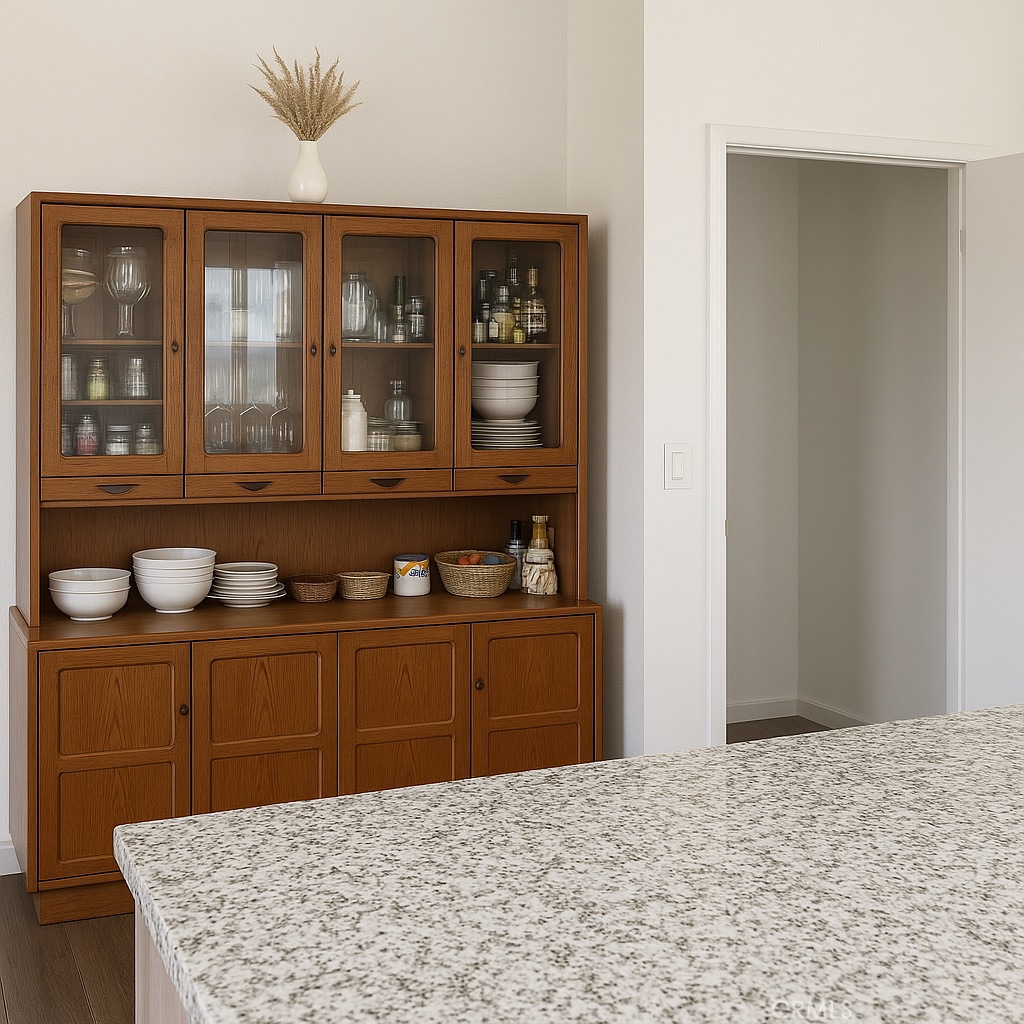 9235 Lindero Road Victorville, CA 92392 - Photo 6 of 11 a bedroom with a bed and wooden cabinets