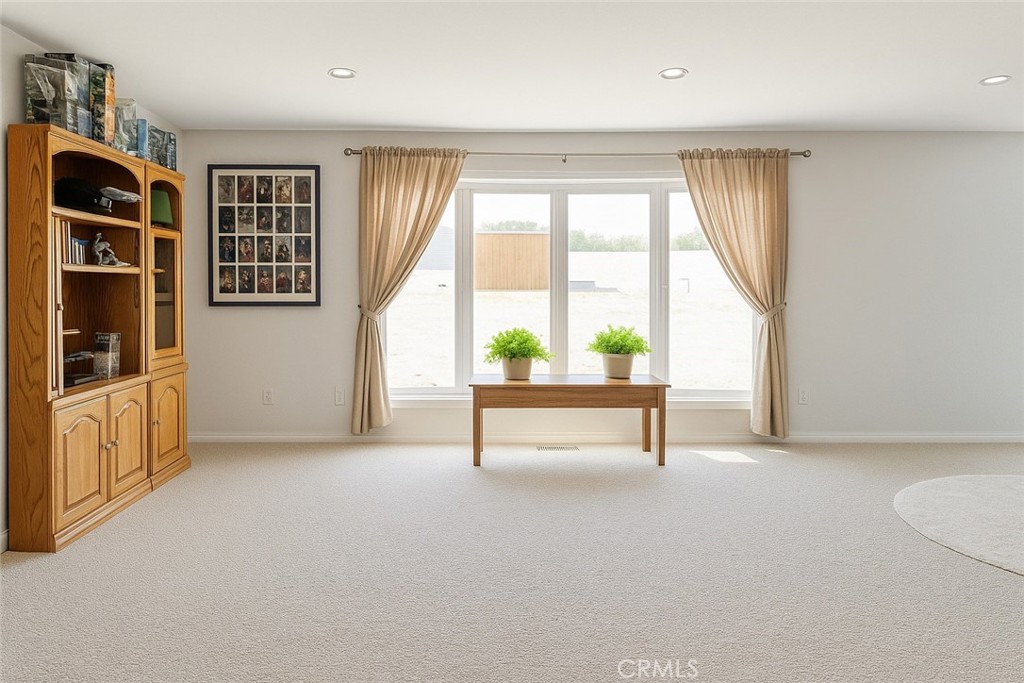 9235 Lindero Road Victorville, CA 92392 - Photo 7 of 11 a living room with furniture and a window