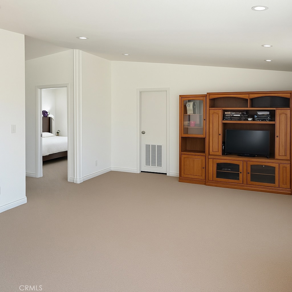 9235 Lindero Road Victorville, CA 92392 - Photo 8 of 11 a view of living room with furniture and a flat screen tv