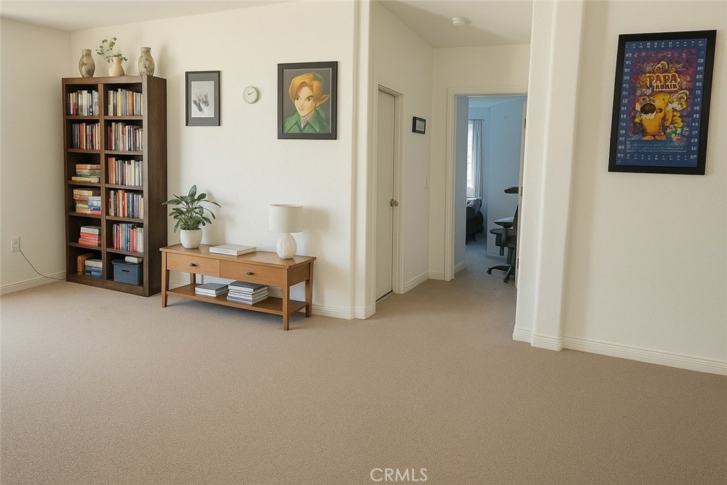 9235 Lindero Road Victorville, CA 92392 - Photo 9 of 11 a view of a livingroom with lounge chair and cabinet