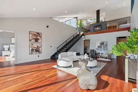 a balcony with table and chairs