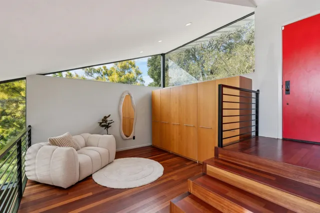 a bathroom with a toilet and a mirror