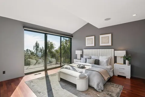 a bathroom with a bathtub sink and mirror