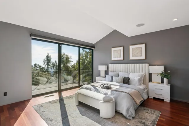 a bathroom with a bathtub sink and mirror
