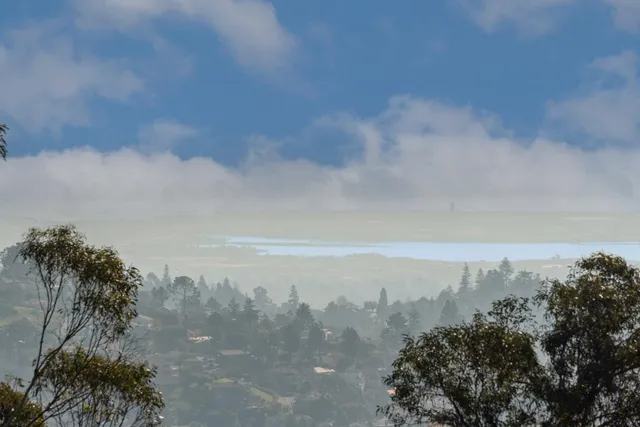 a bedroom with a bed and a night stand