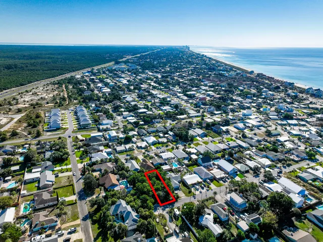 an aerial view of multiple house with yard