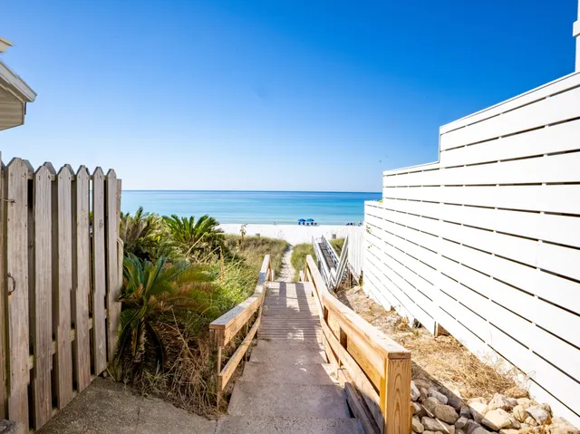 a view of a balcony with chairs