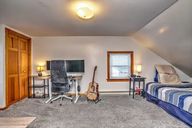a view of a livingroom with furniture and a flat screen tv
