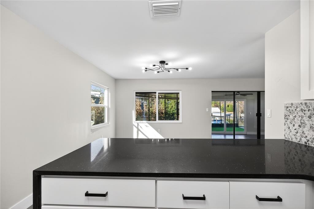 1503 Canal Court Tavares, FL 32778 - Photo 14 of 41 a view of entryway and hall with a large window