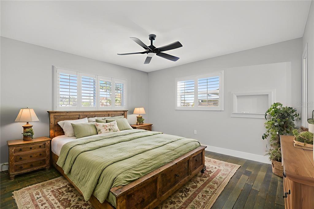 1503 Canal Court Tavares, FL 32778 - Photo 21 of 41 a bedroom with a bed and a potted plant