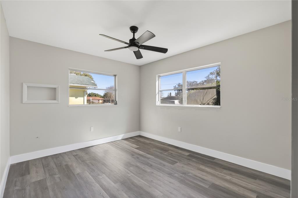 1503 Canal Court Tavares, FL 32778 - Photo 26 of 41 a view of empty room with wooden floor