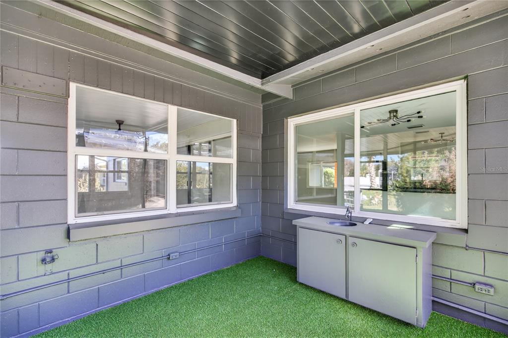 1503 Canal Court Tavares, FL 32778 - Photo 29 of 41 a bathroom with a sink and a large window