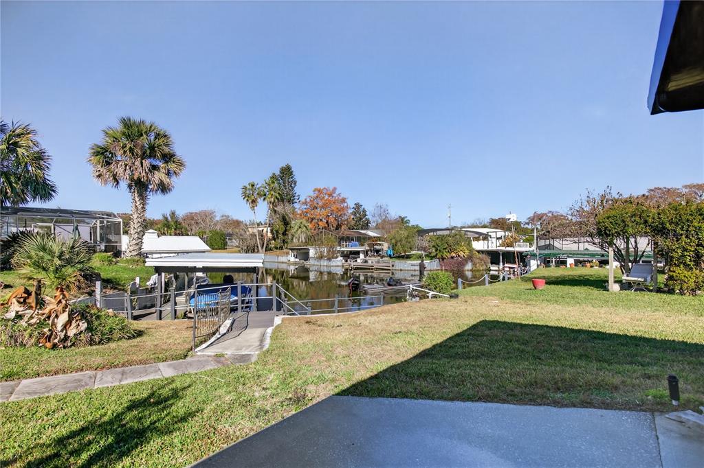 1503 Canal Court Tavares, FL 32778 - Photo 32 of 41 an outdoor space with garden and seating area
