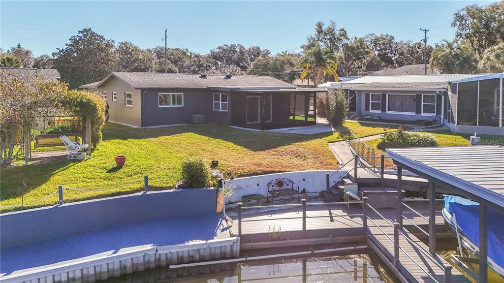1503 Canal Court Tavares, FL 32778 - Photo 39 of 41 a view of a house with swimming pool