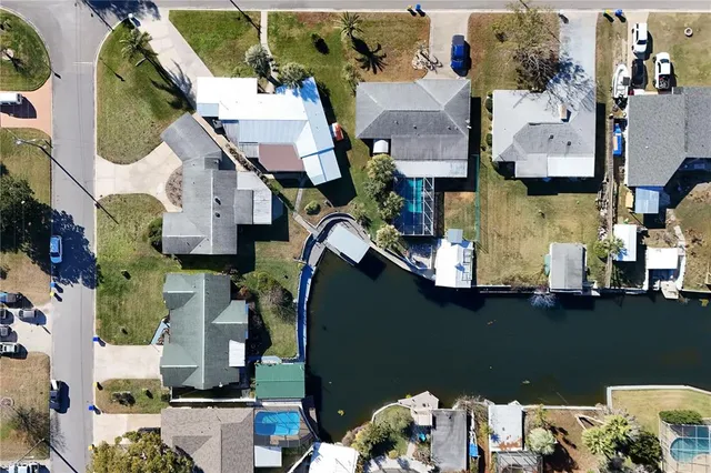 an aerial view of houses with outdoor space