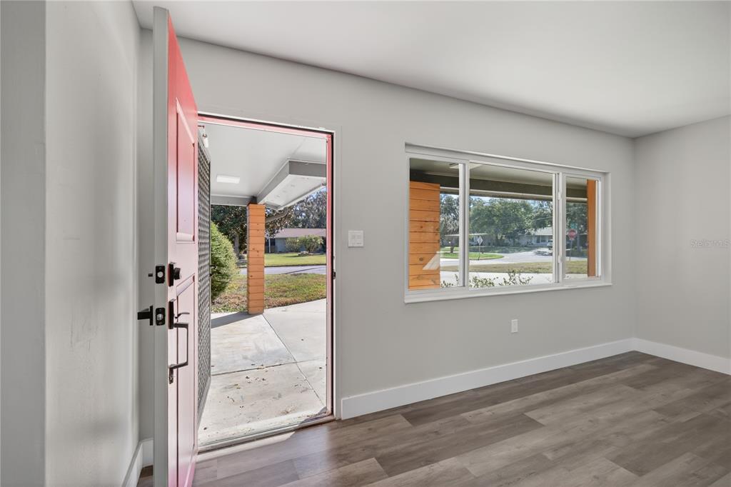 1503 Canal Court Tavares, FL 32778 - Photo 5 of 41 an empty room with large window and a livingroom view