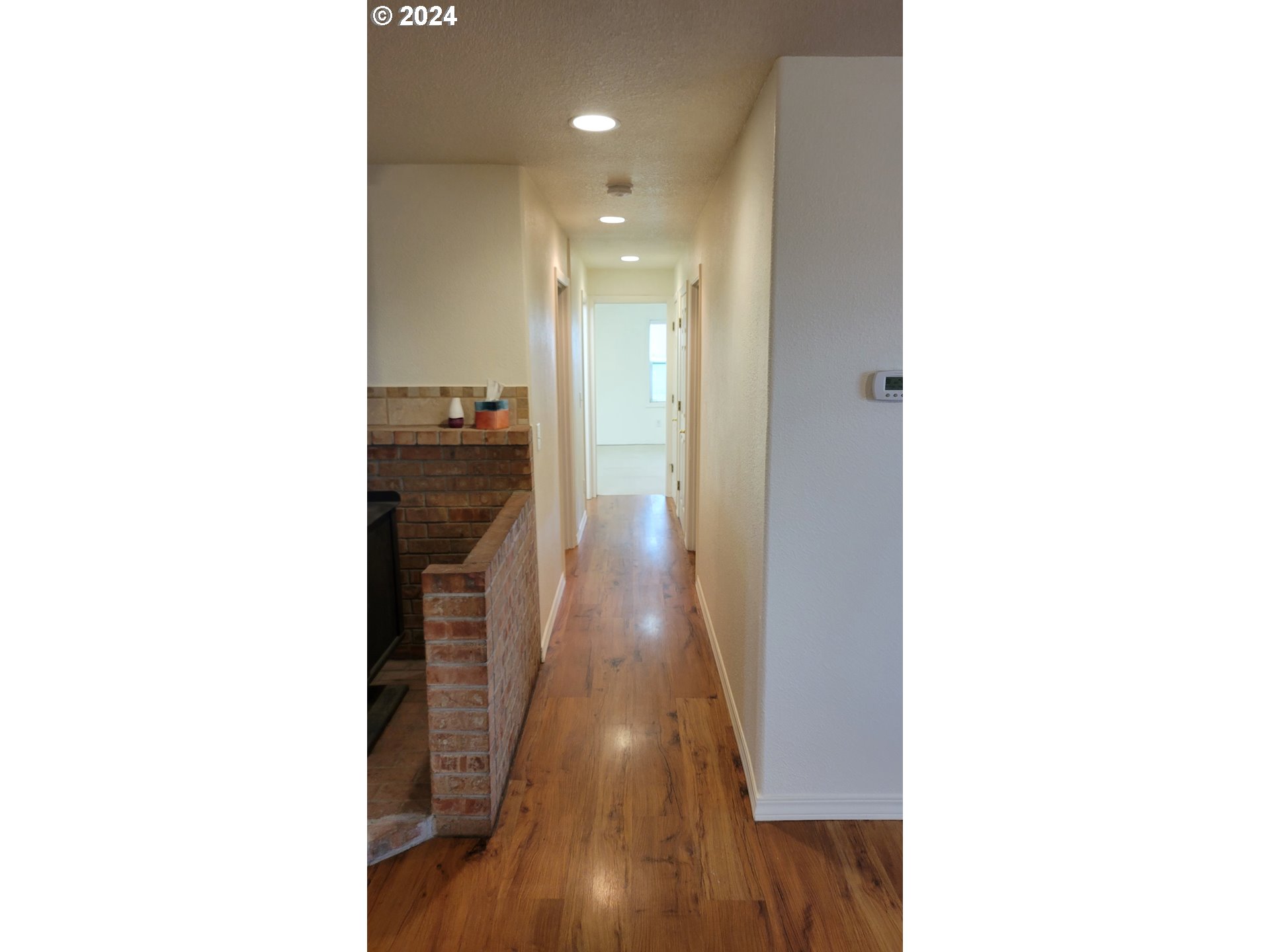 4701 Concomly Road Northeast Gervais, OR 97026 - Photo 7 of 33 a view of a hallway with wooden floor