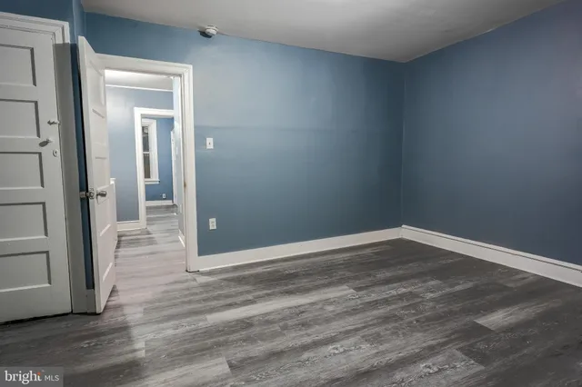 wooden floor and cabinet in an empty room