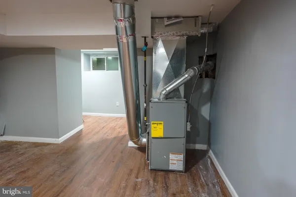 a view of hallway with wooden floor