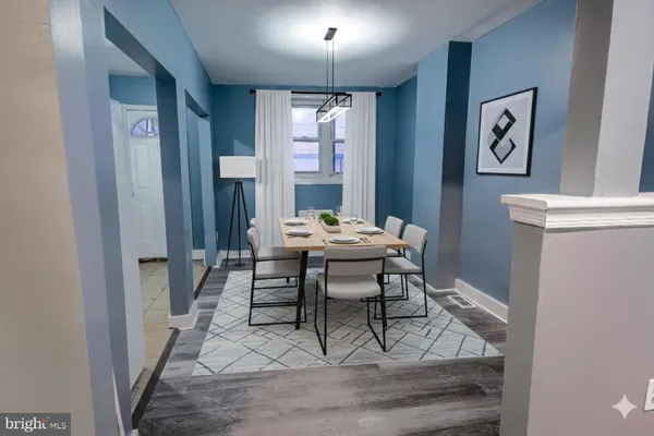 a view of a dining room with furniture and window
