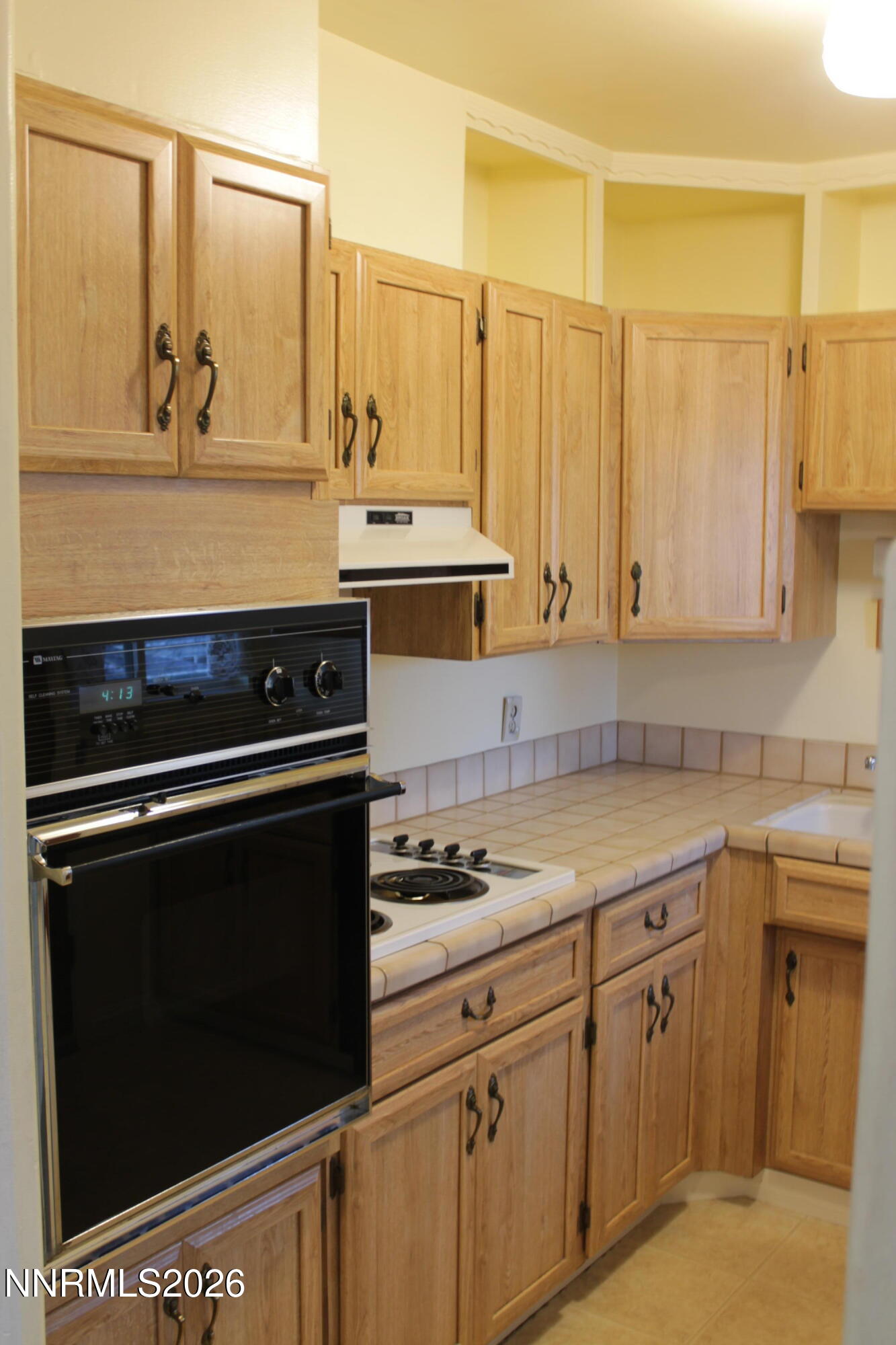 1940 4th Street, Unit 46 Sparks, NV 89431 - Photo 7 of 21 a kitchen with stainless steel appliances a stove a sink and cabinets