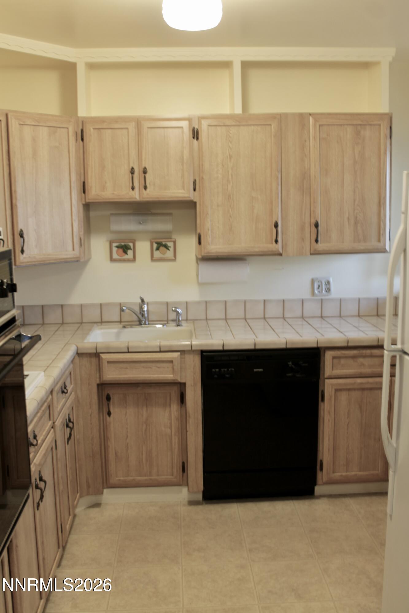 1940 4th Street, Unit 46 Sparks, NV 89431 - Photo 8 of 21 a kitchen with stainless steel appliances granite countertop a sink and cabinets