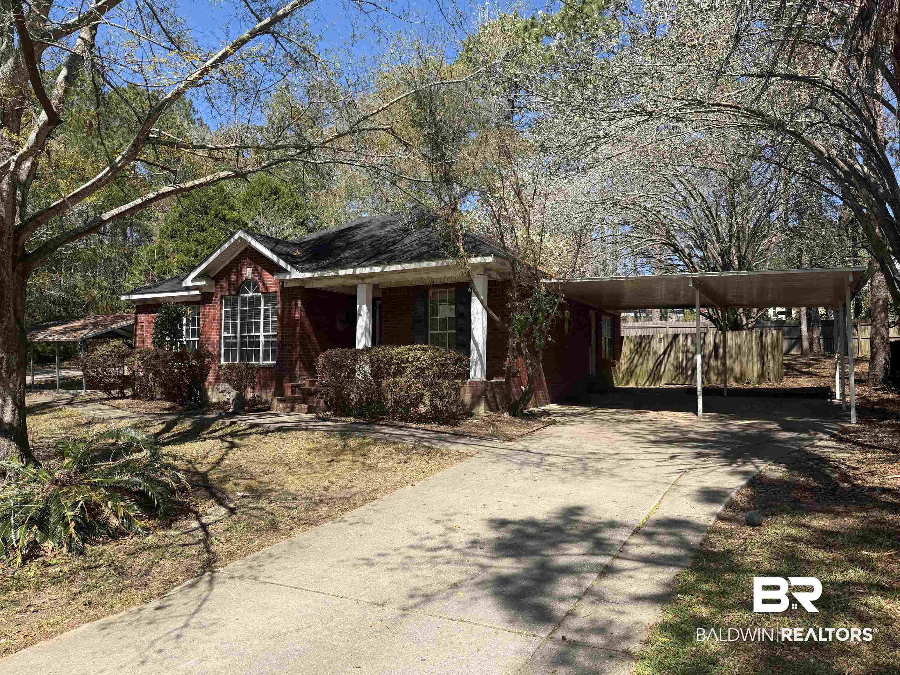 7067 Pinehill Road Daphne, AL 36526 - Photo 4 of 18 Single story home with a porch, driveway, and brick siding