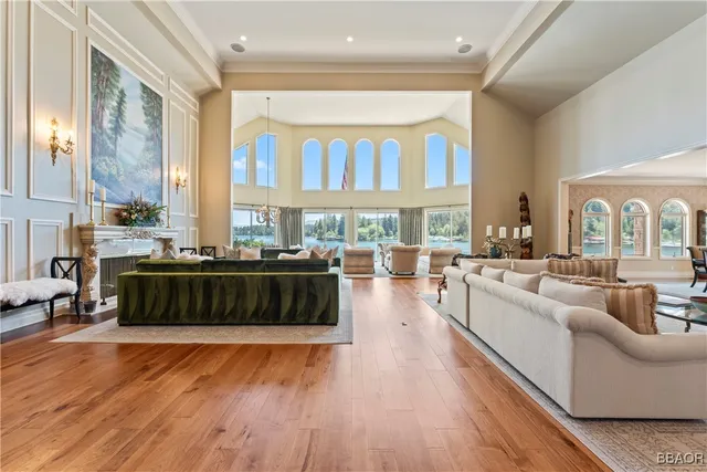 a living room with furniture and large windows