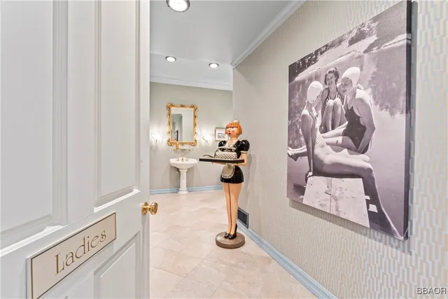 a view of living room filled with furniture and air hockey table