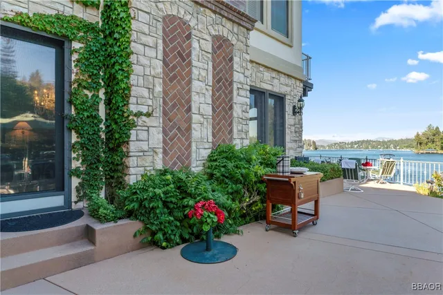 a garden with a bench in front of house