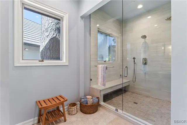 a bathroom with a tub and shower