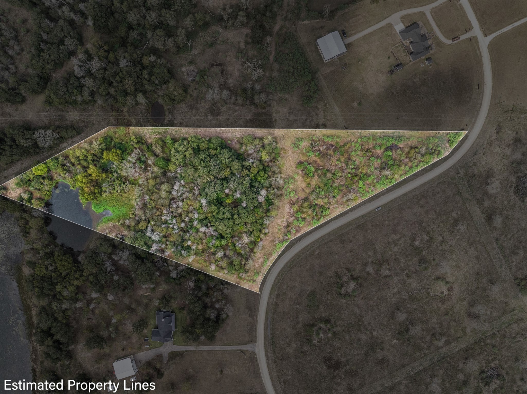 a view of a yard with wooden fence