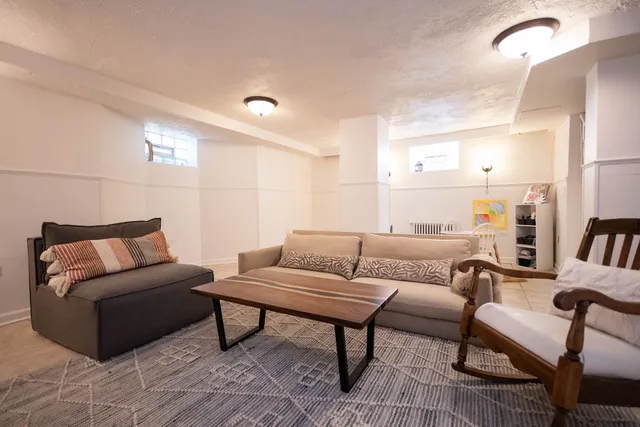 a living room with furniture and a rug