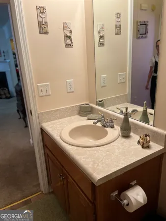 a bathroom with a bath tub a sink and a toilet