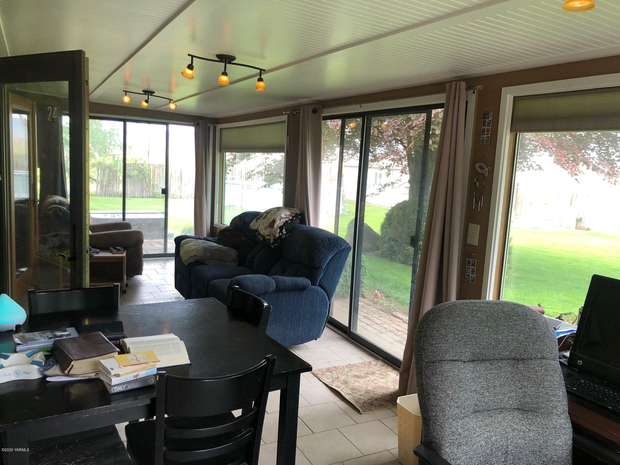 170 St Mary Road Harrah, WA 98933 - Photo 11 of 26 a living room with furniture and large windows