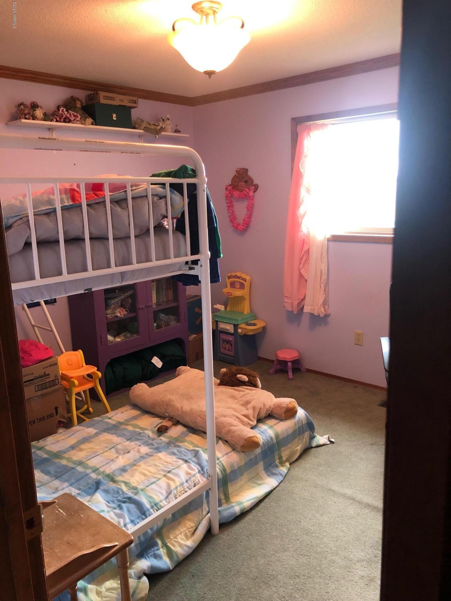 170 St Mary Road Harrah, WA 98933 - Photo 13 of 26 a bedroom with bed and a window