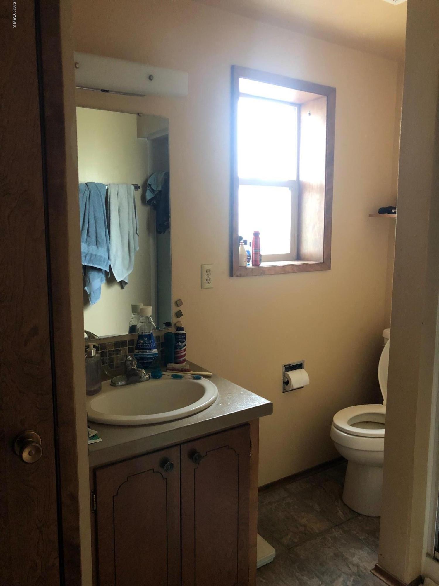 170 St Mary Road Harrah, WA 98933 - Photo 14 of 26 a bathroom with a sink toilet and mirror