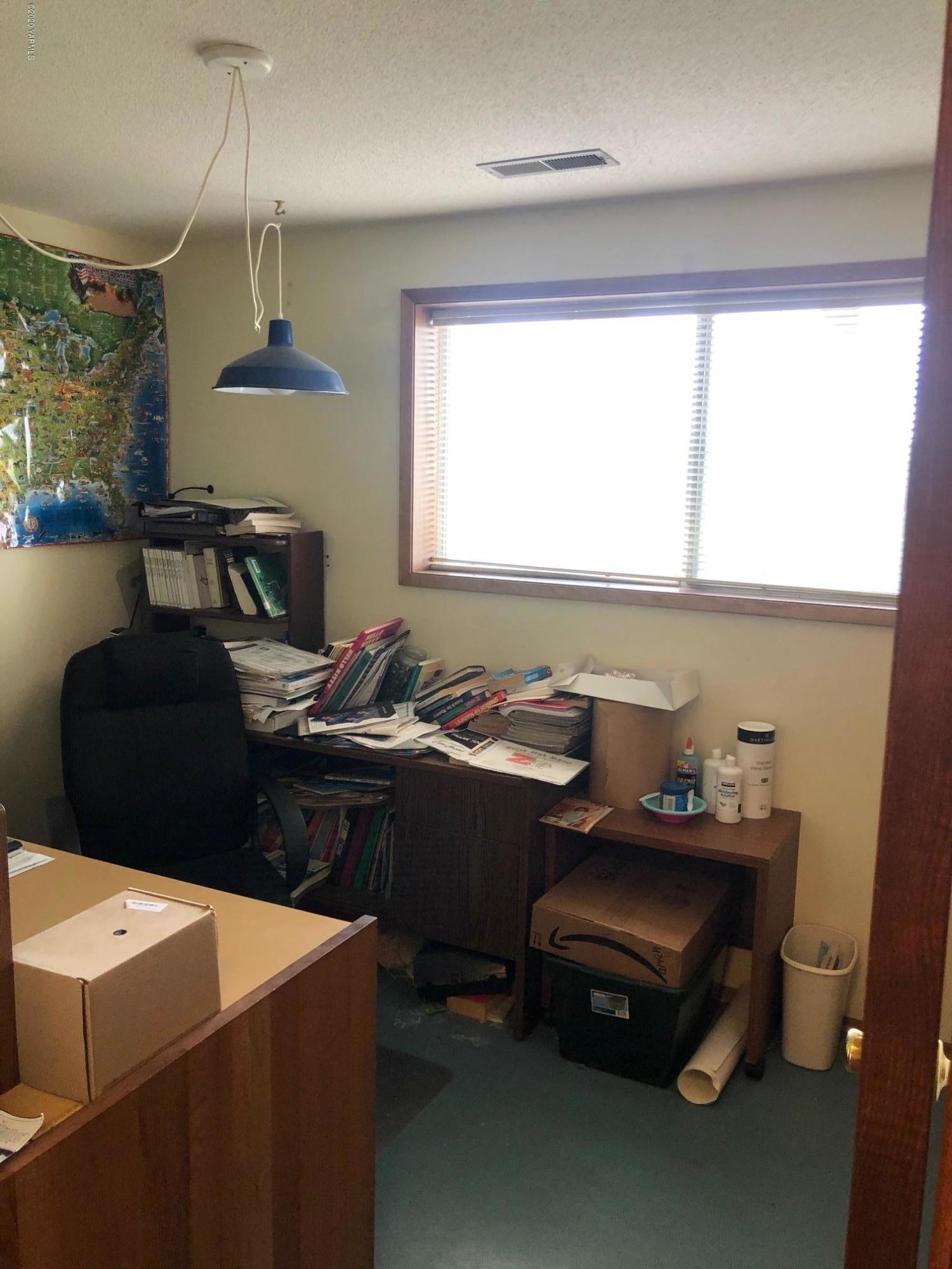 170 St Mary Road Harrah, WA 98933 - Photo 16 of 26 a view of a workspace with furniture and a window