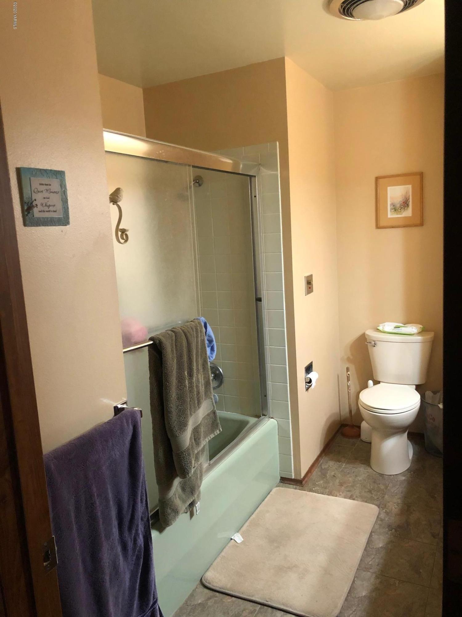 170 St Mary Road Harrah, WA 98933 - Photo 18 of 26 a bathroom with a toilet and a shower
