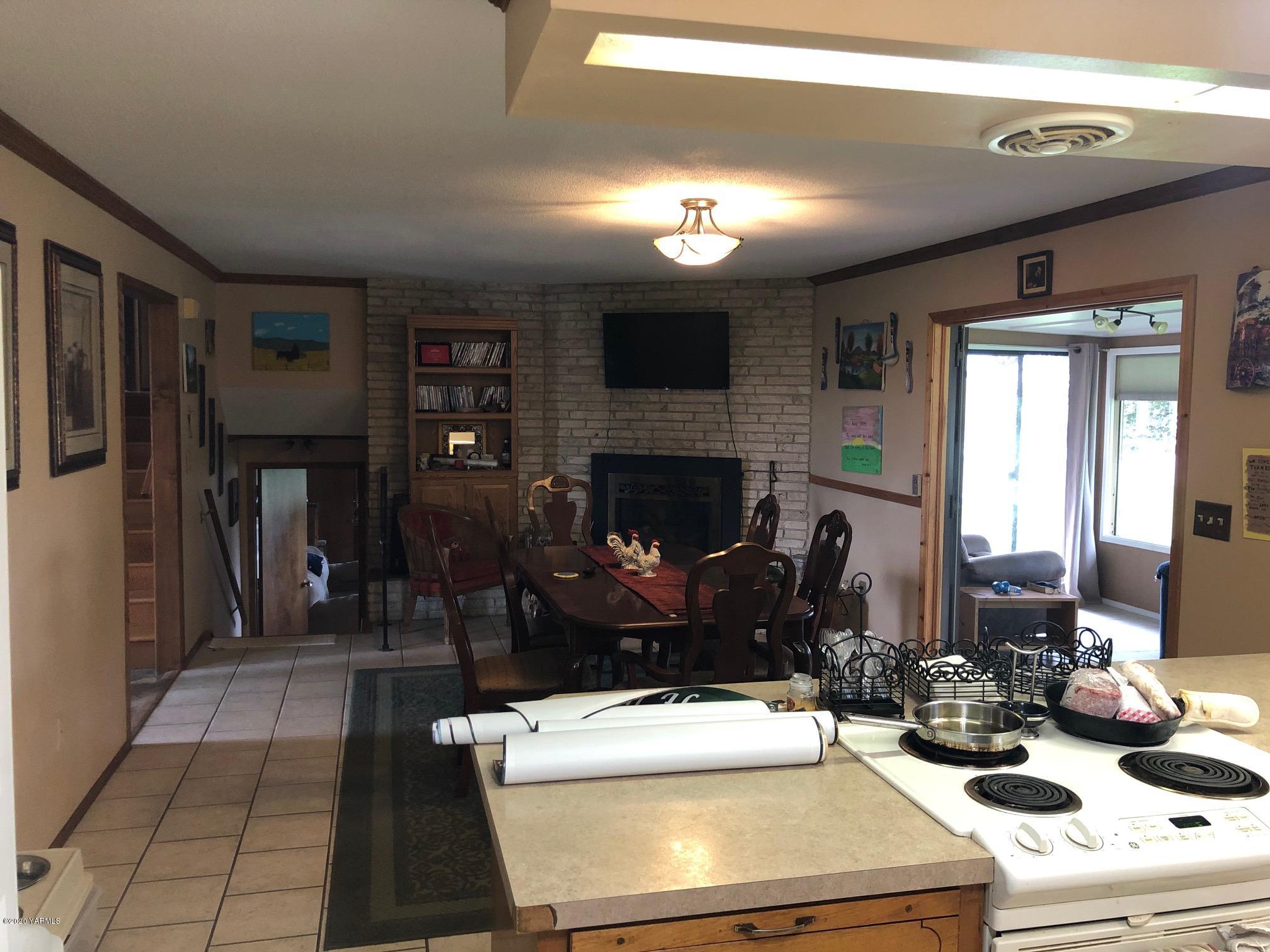 170 St Mary Road Harrah, WA 98933 - Photo 23 of 26 a room with furniture and a fireplace